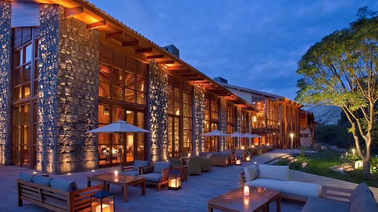 Lodge-style architecture and heated pool of Tambo del Inka beside the Urubamba River