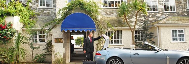 The Nare hotel above the dunes and sands of Carne Beach on the Roseland Peninsula