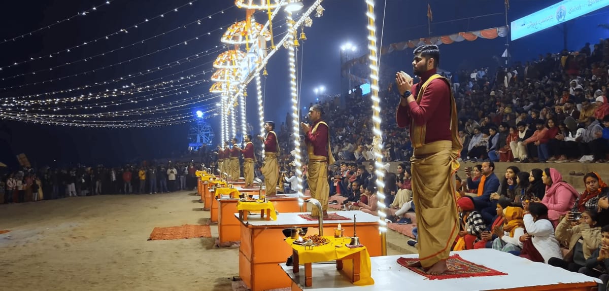 Priests holding flaming brass lamps during the grand Ganga Aarti ceremony at Dashashwamedh Ghat