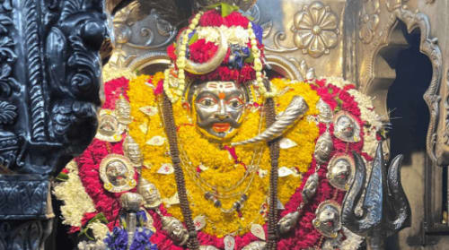 Sacred entrance and brass bells of Shri Kaal Bhairav Temple in Varanasi