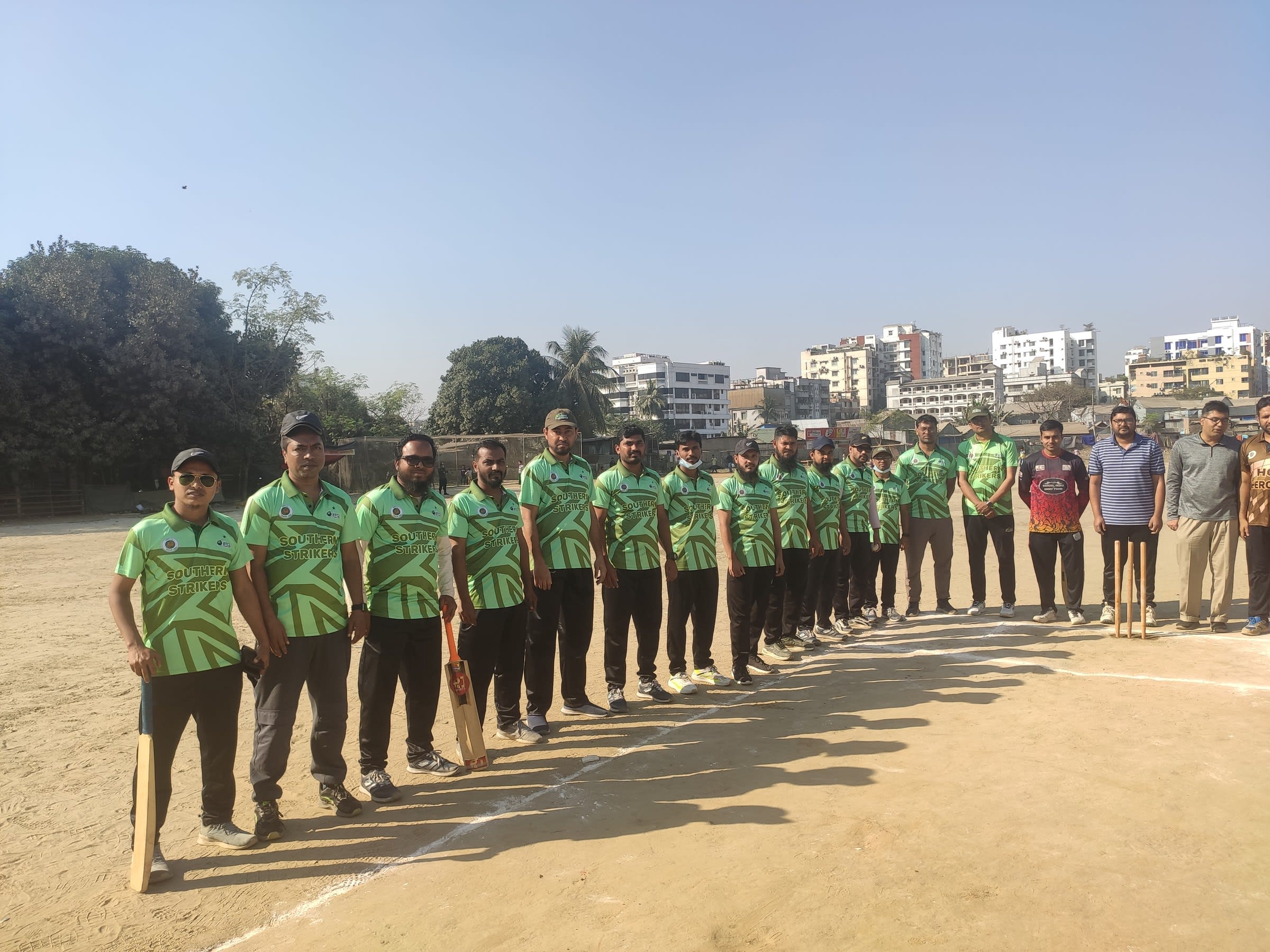 Players lined up on the ground before a match