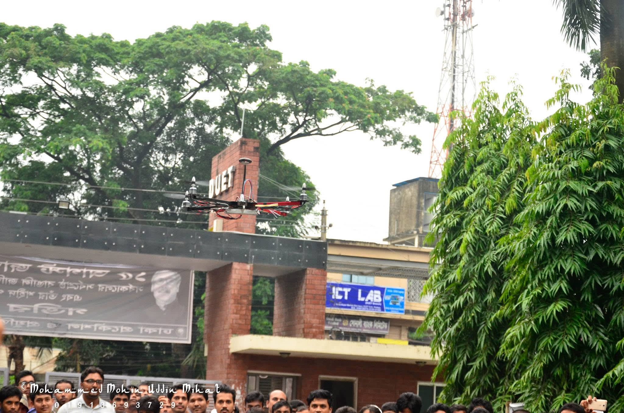 The quadcopter flying in front of the DUET main gate