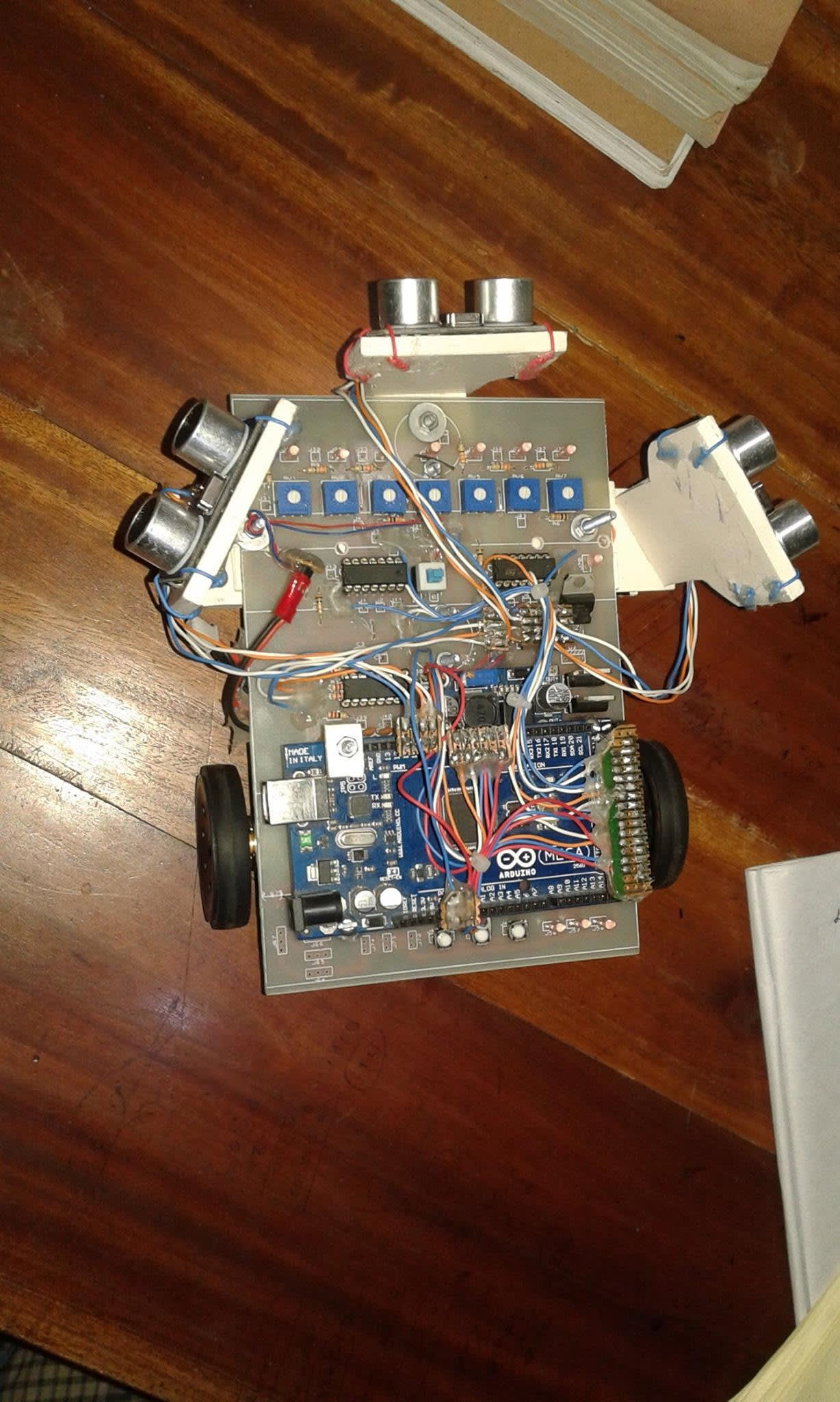 Our line follower and maze, built in-house on a custom circular PCB with an Arduino Nano controller