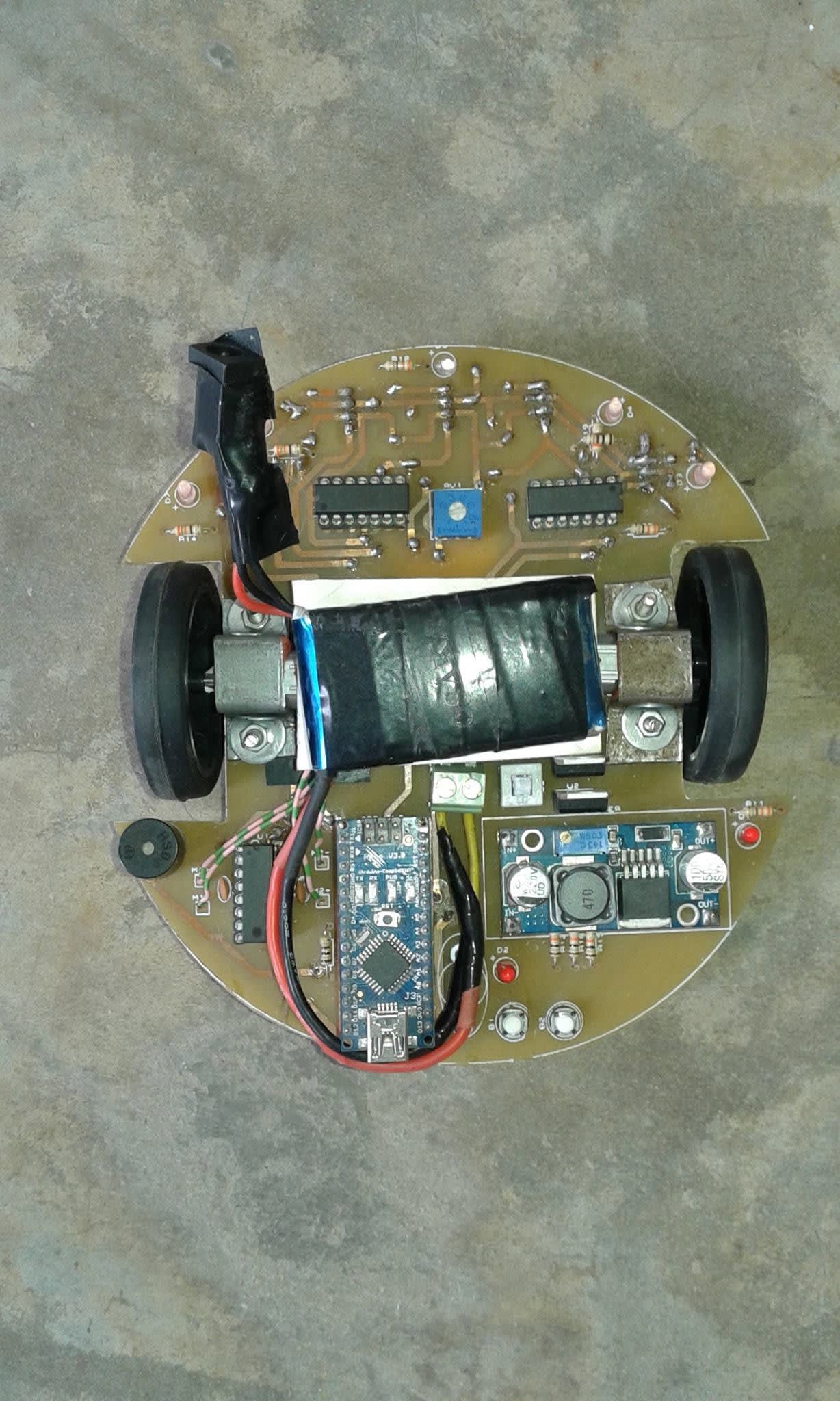 Our maze-solving robot, built in-house on a custom circular PCB with an Arduino Nano controller
