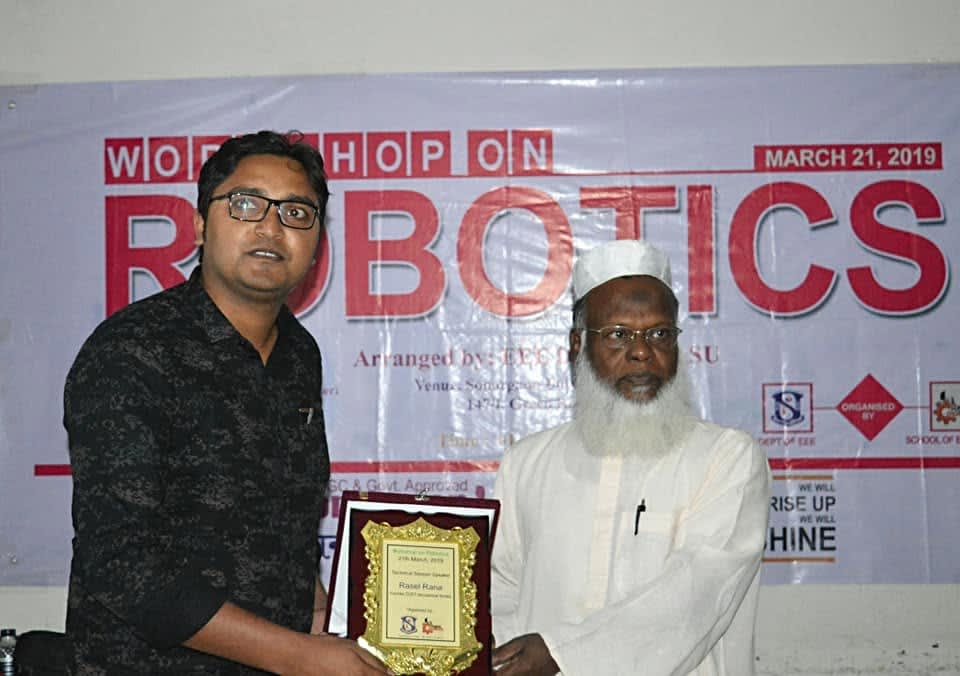 Receiving a crest as Technical Session Speaker at the Workshop on Robotics, Sonargaon University, Dhaka