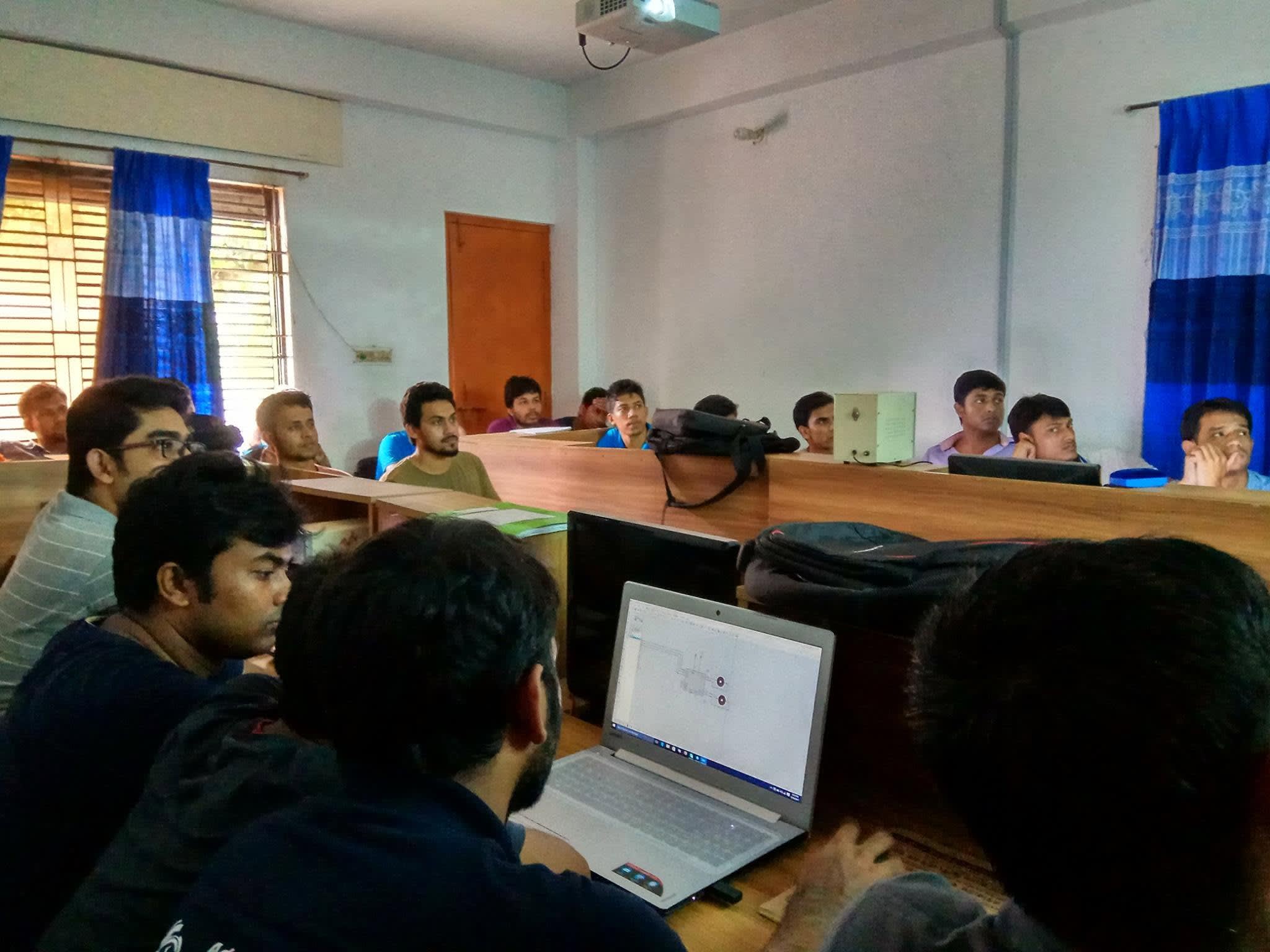 Participants following a Proteus simulation of an Arduino-controlled motor circuit