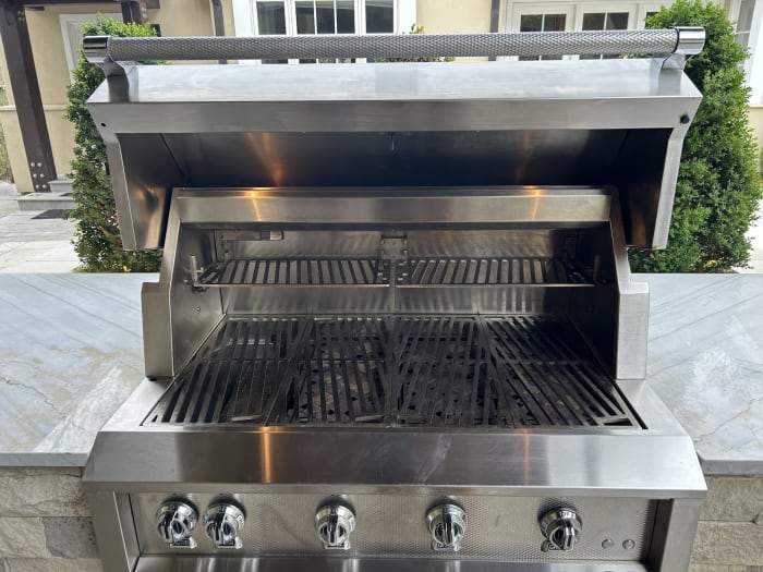 Built-in outdoor kitchen grill after professional deep cleaning