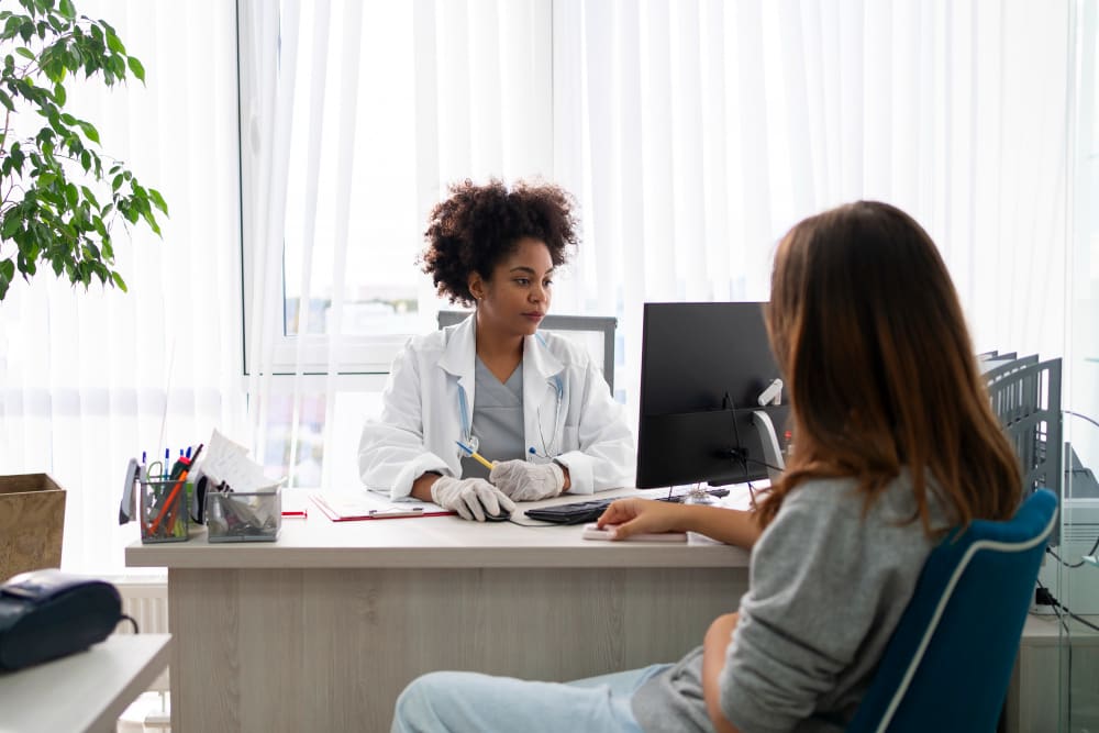Chiropractor assessing a patient's range of motion