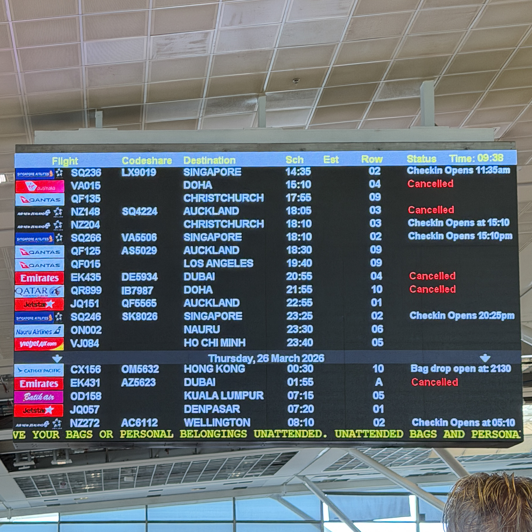Brisbane Airport departure board showing multiple Middle East flight cancellations including Emirates and Qatar