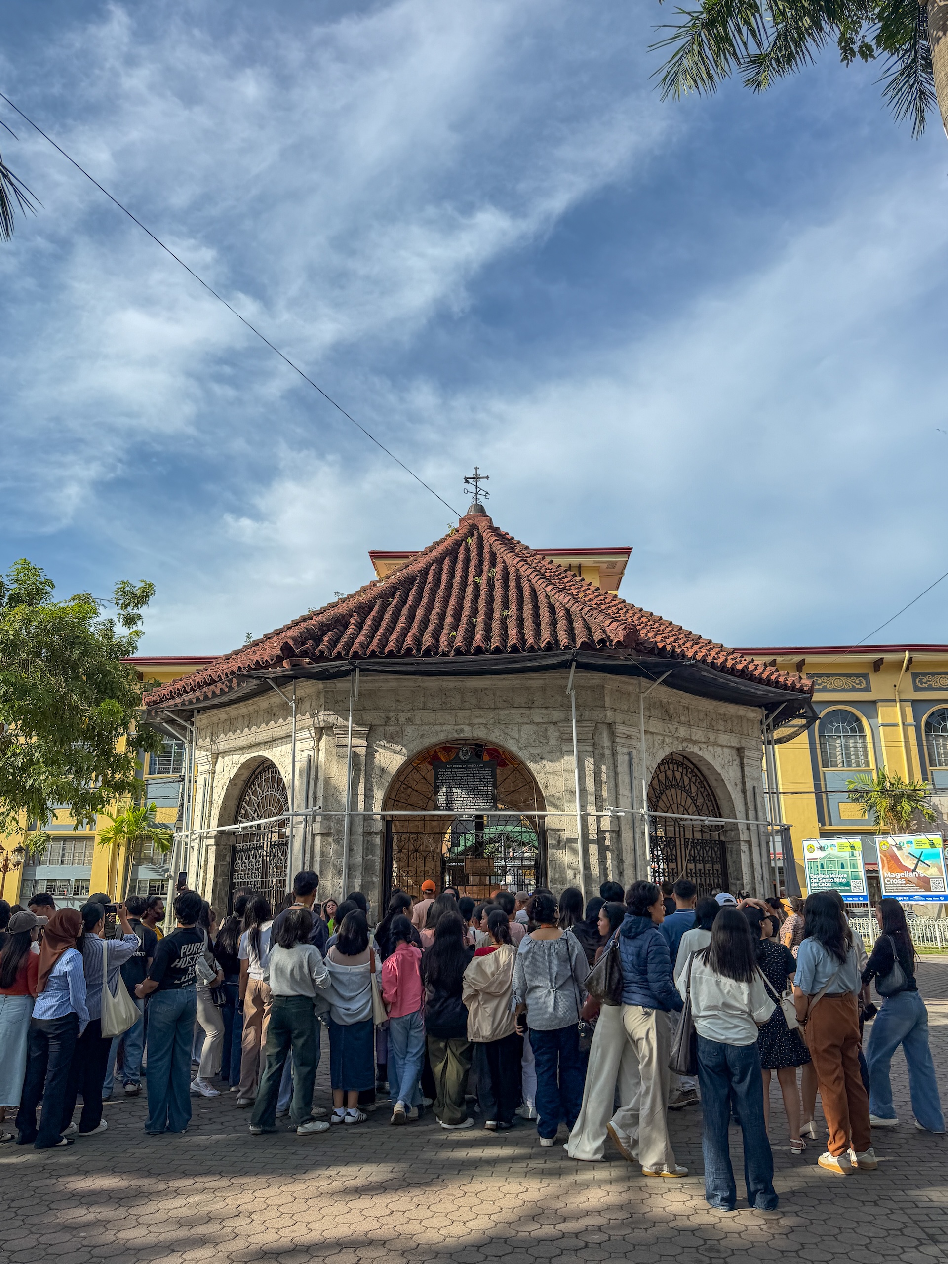 Crowd gathered outside the octagonal stone pavilion of Magellan&rsquo;s Cross in downtown Cebu