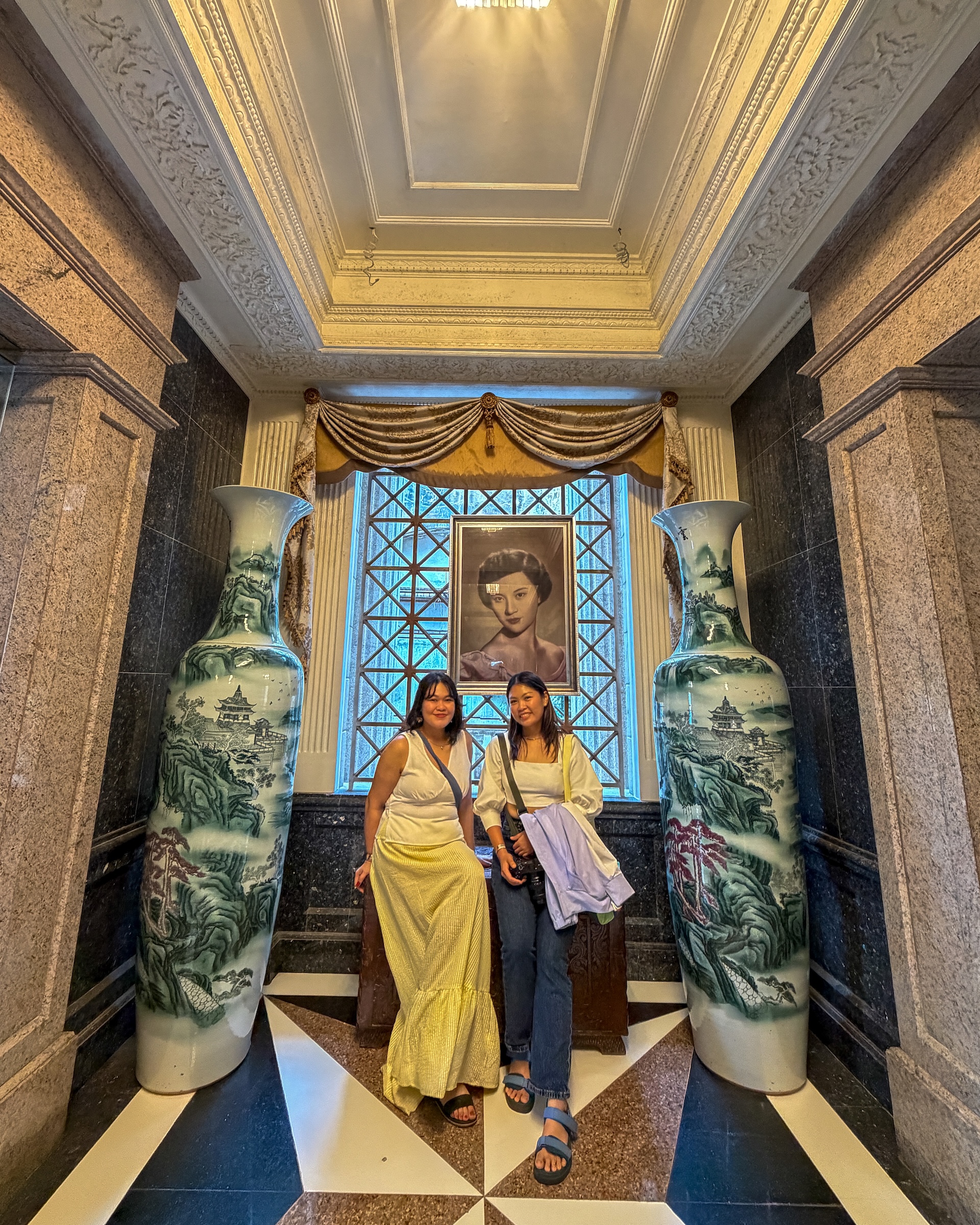 Posing inside Temple of Leah Cebu beside large Chinese vases with portrait of Leah Adarna in the background