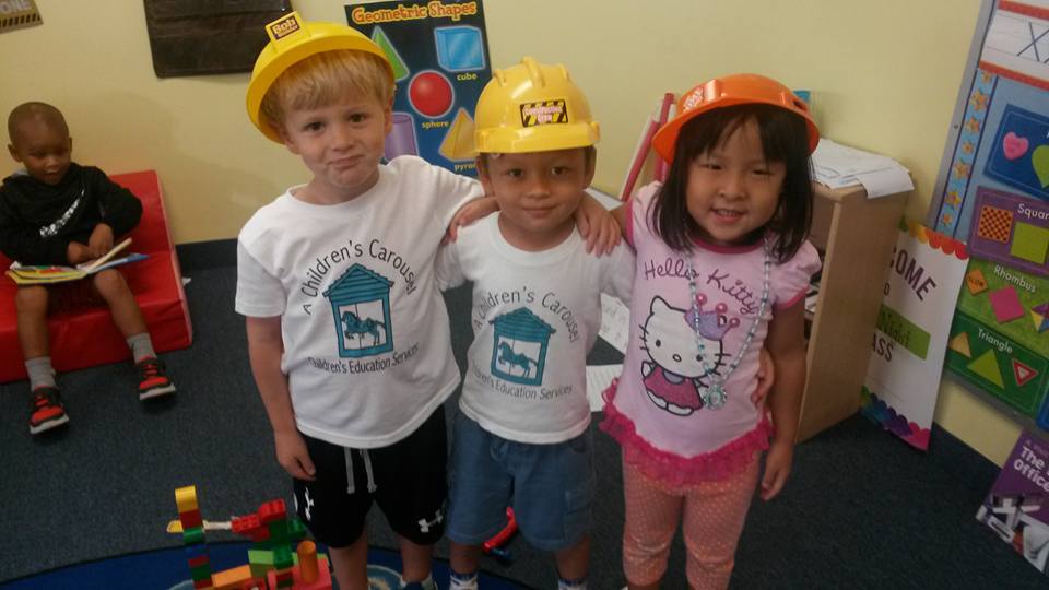 Preschoolers at a children's carsousel