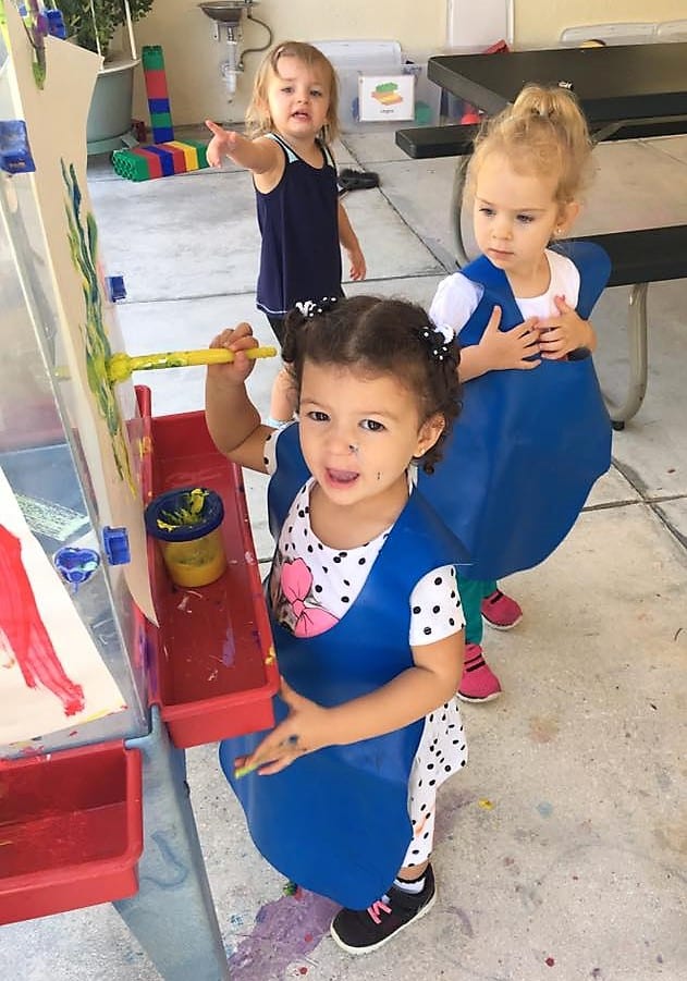 preschool, preschooler painting, preschool at a childrens carousel