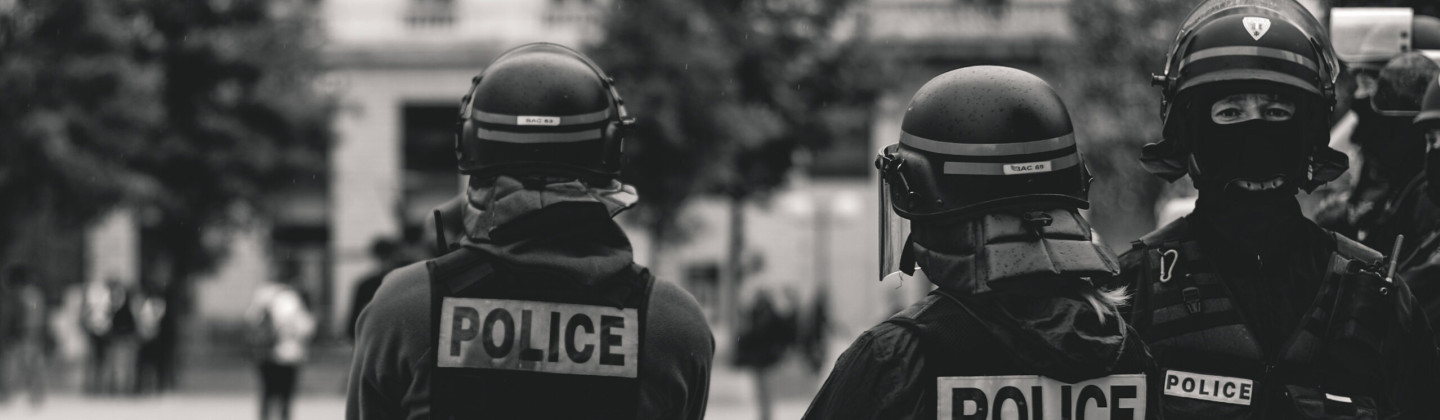 Three Police Officers in Riot Gear