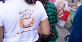 Image shows the back of a woman's t-shirt at a protest in Bogota. The shirt reads 'Respeto - no a la homofobia, bifobia y transfobia