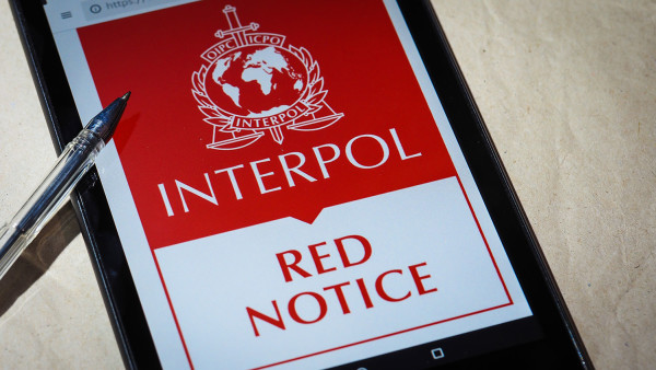 Text reading Interpol Red Notice