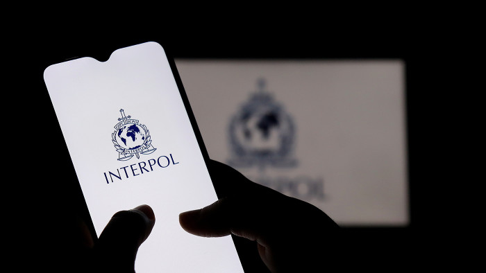 Smartphone with Interpol logo