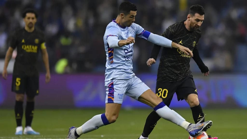 Bruised Ronaldo scores twice to edge showdown with Messi Bruised Ronaldo scores twice to edge showdown with Messi