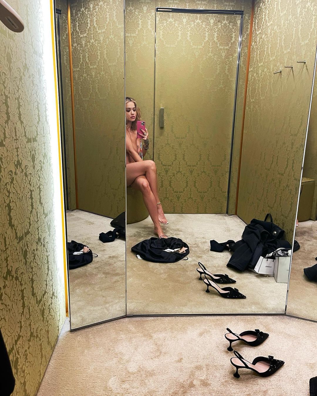 Rita Ora strips off and poses NUDE in a mirrored changing room