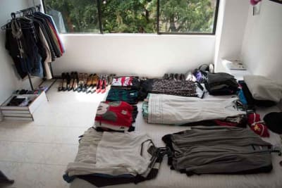 Bed full of clothes - Closet Decluttering