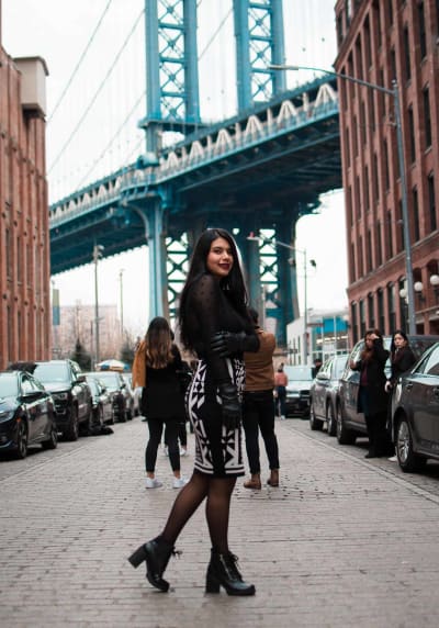 Mesh star top with black, white skirt, leather gloves, chunky boots.