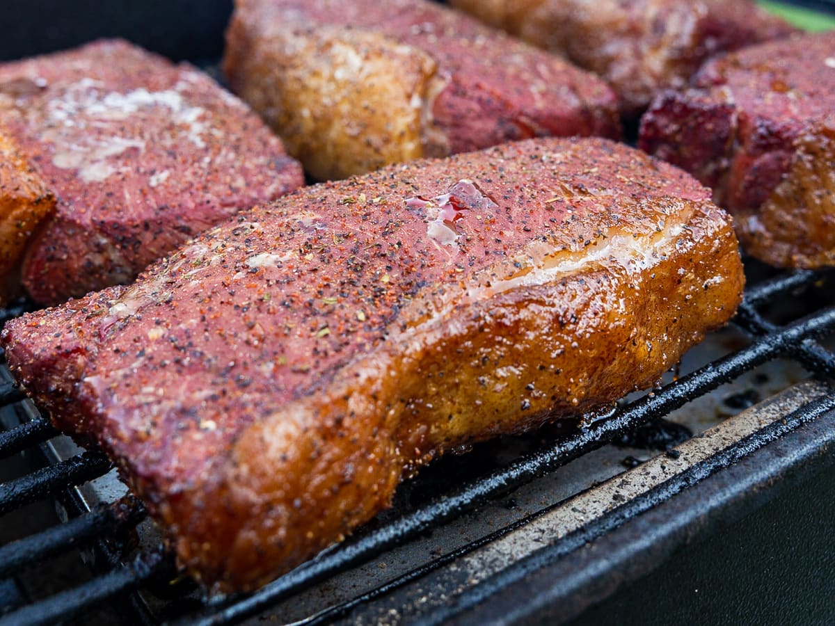 Smoke steaks at 225°F for 1-1.5 hours