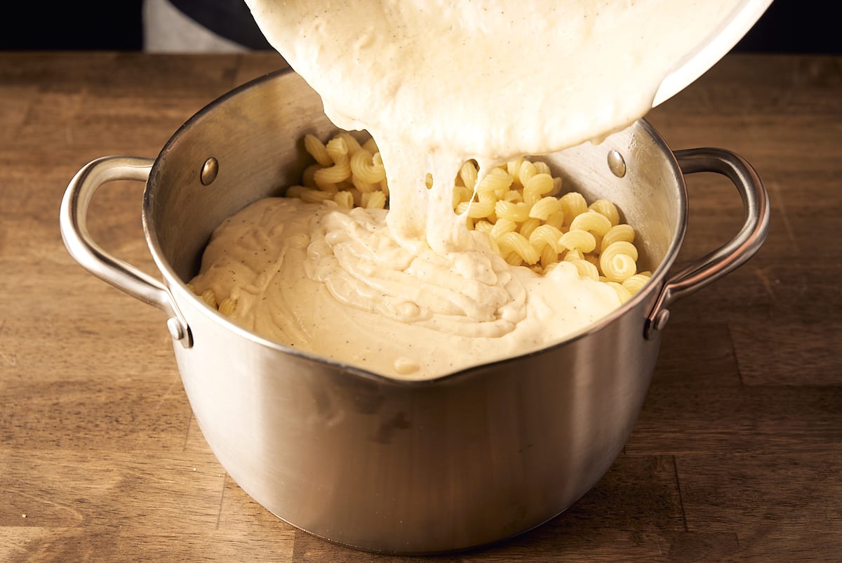 Add cream and cheese sauce to the drained pasta