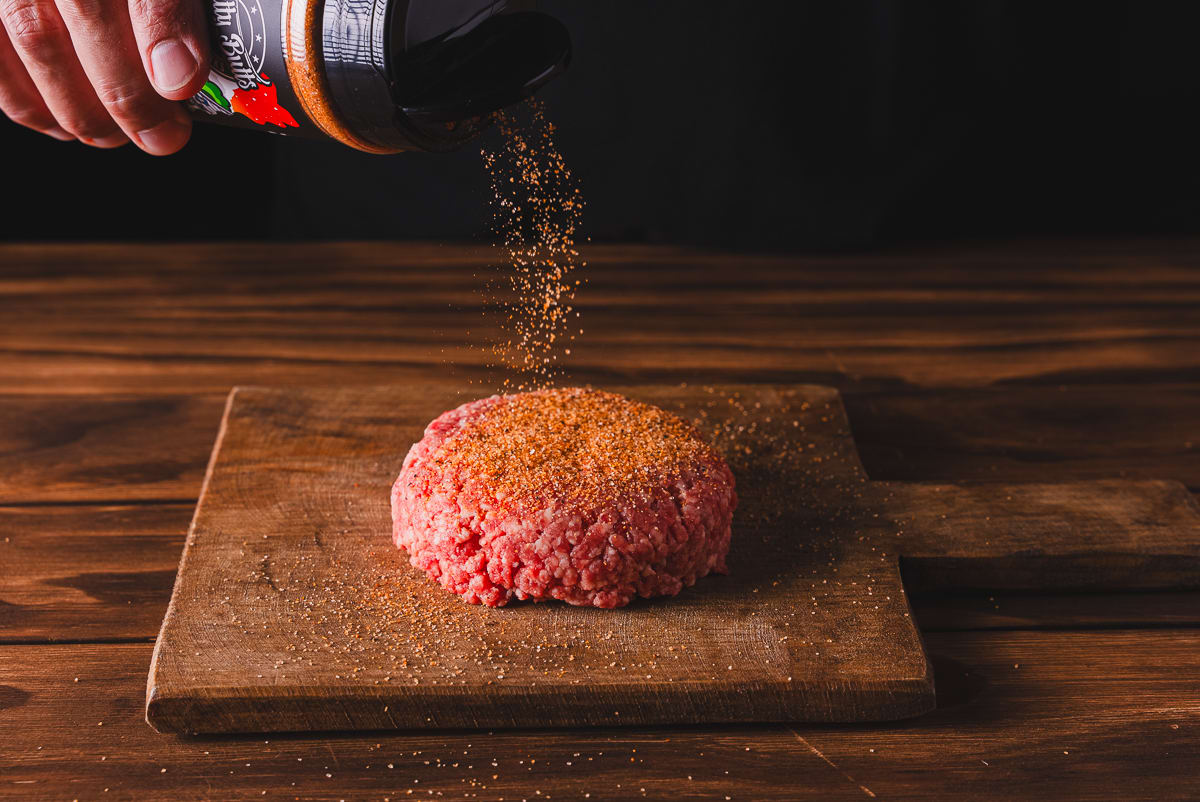 Form the ground beef into 4 equal size patties and season