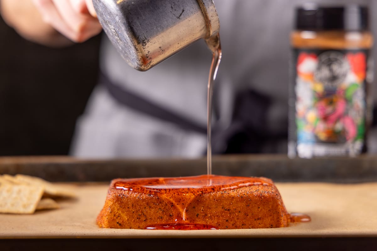 Pouring glaze on smoked cream cheese