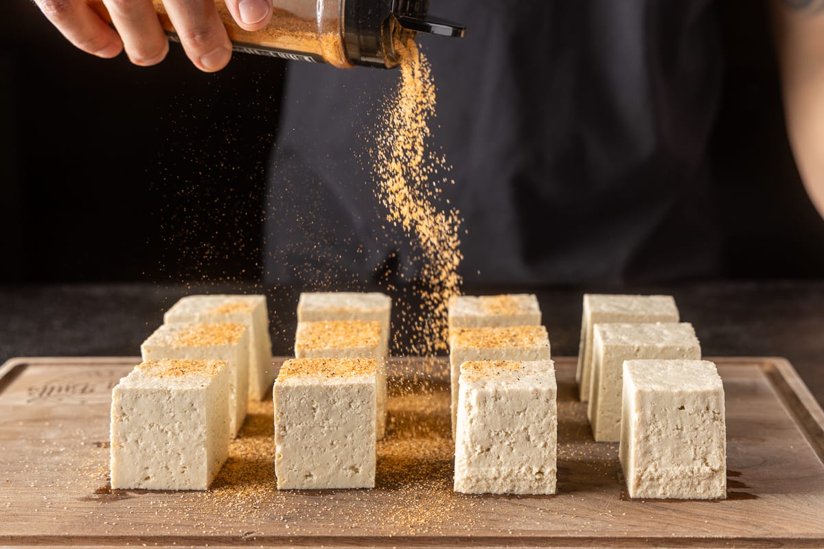 Season the tofu using BBQ rub before smoking