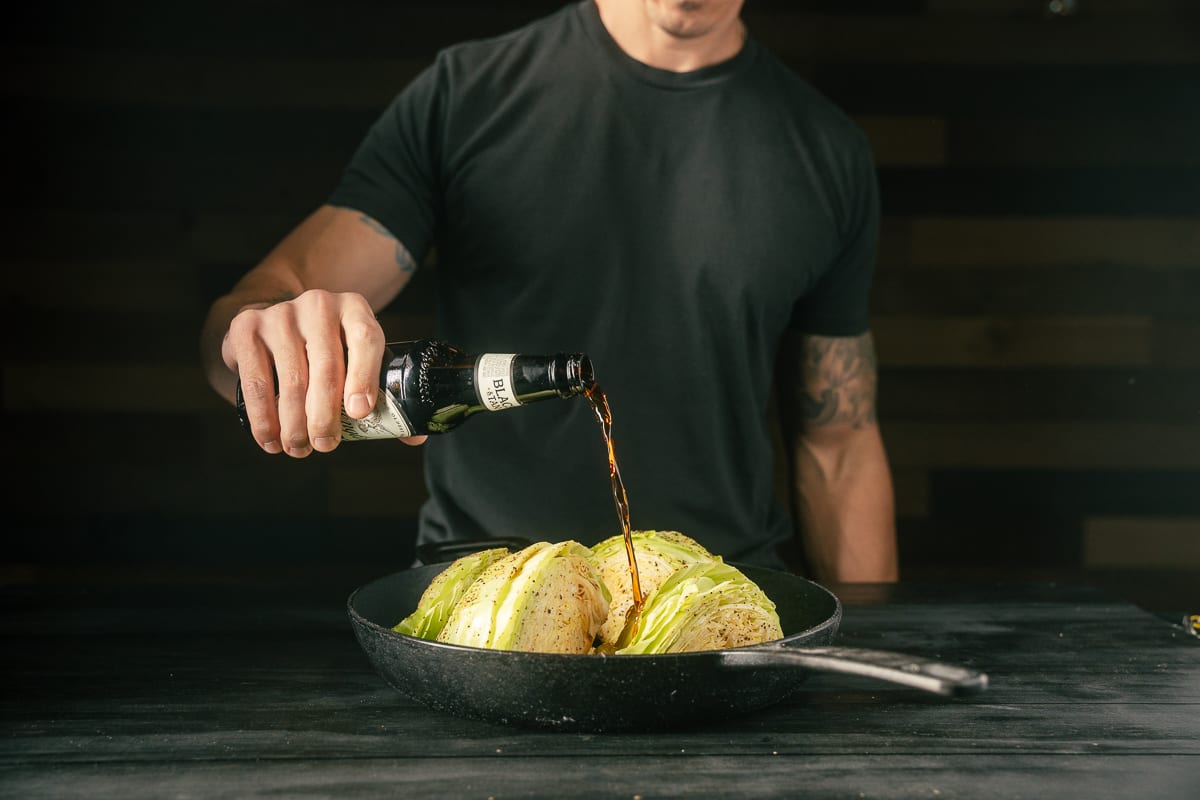 Add beer and cabbage to a cast iron pan