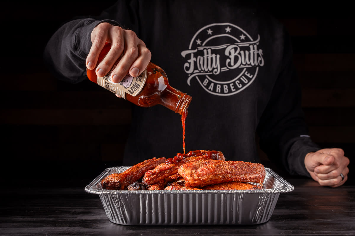 Coat the party ribs in BBQ sauce