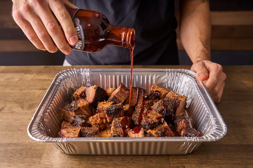 Coat the poor man's burnt ends in bbq sauce
