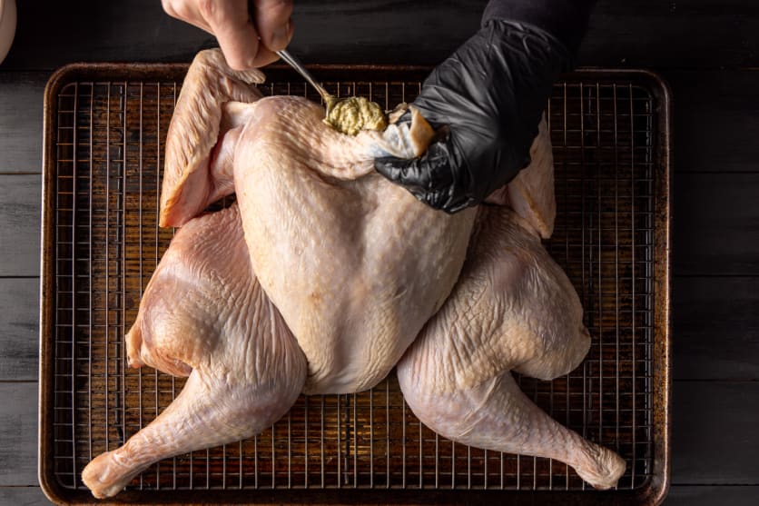 Spread herb butter mixture under turkey skin