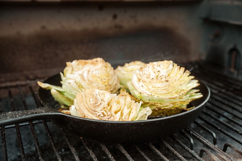Smoked cabbage braising in a smoker