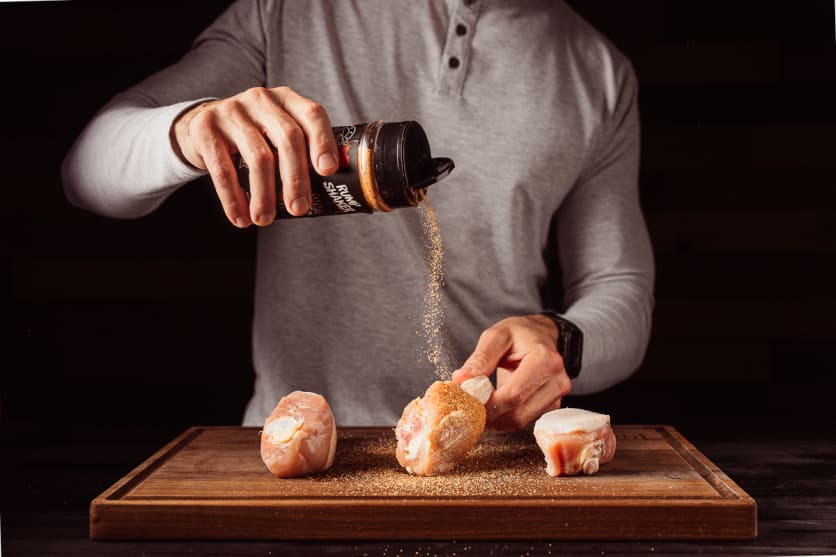 Apply seasoning to chicken legs