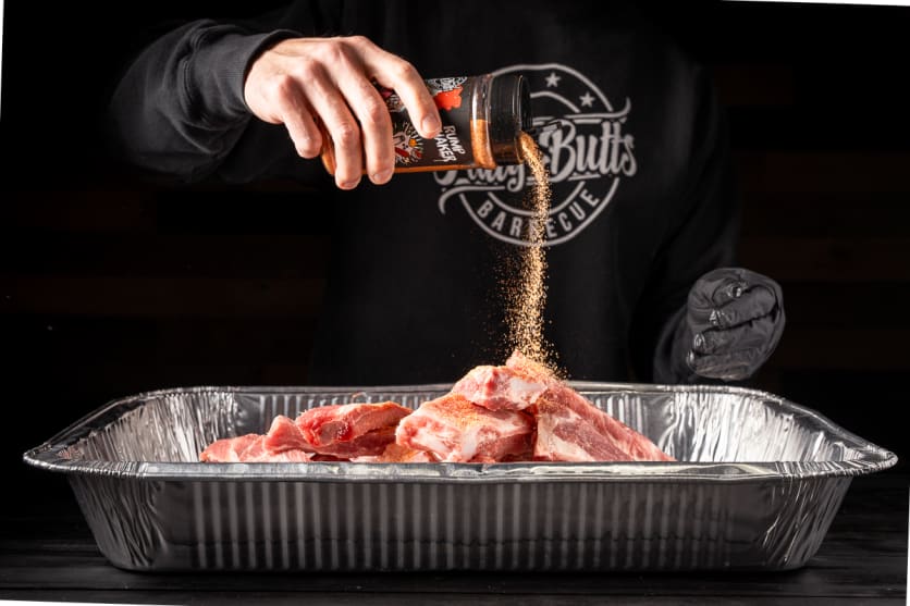 Season the party ribs with BBQ rub