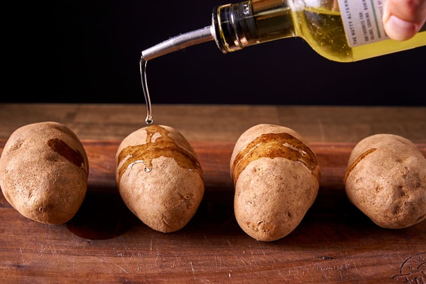 Rub oil over the potatoes