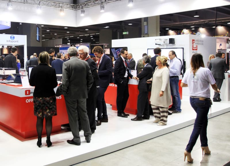 validation-tradeshow-expo Franchise trade show exposition people meeting and talking around tables
