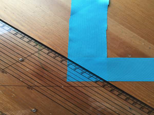 Use a ruler to create a diagonal line for stitching.