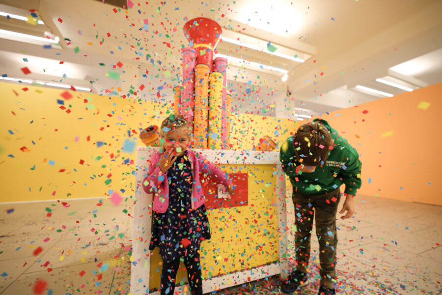 Visitors inside the colourful Happy Rooms creative experience in Middlesbrough