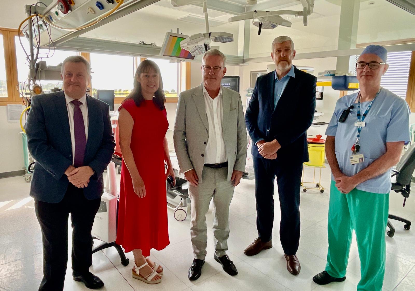Health and finance ministers with staff at Downe Hospital Day Procedure Unit