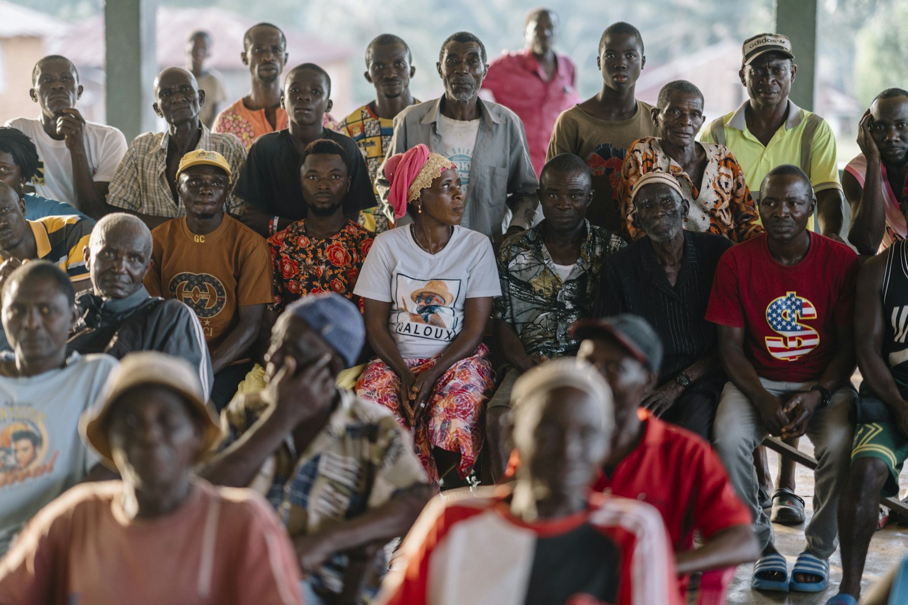 A diverse group of people sitting together, used as a representative image for community support work