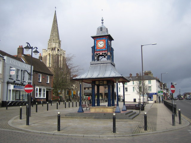 Dunstable Clock Tower and Market Cross. Representative photograph of Dunstable; it does not show Harmony, her family or the food redistribution work.