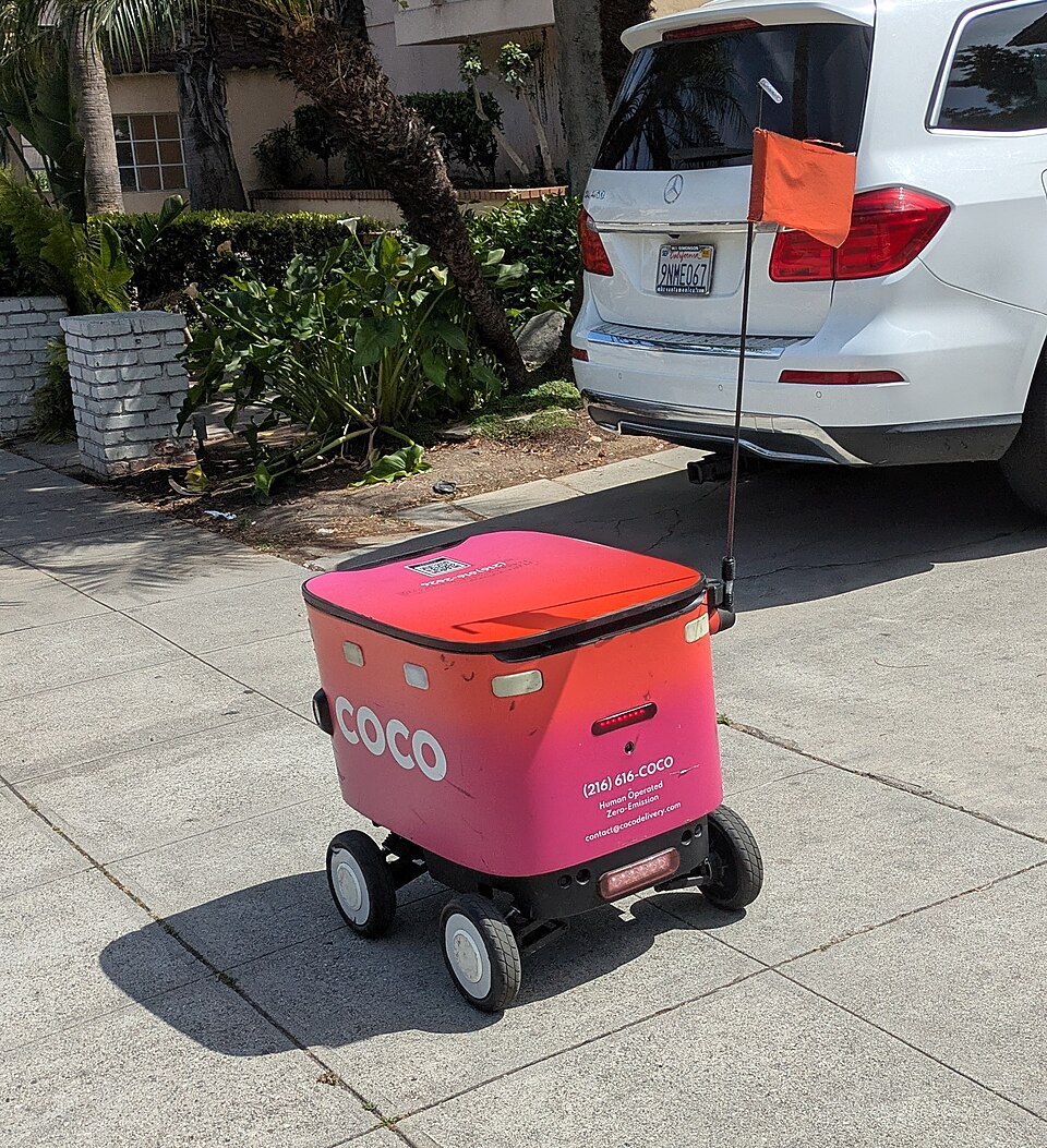 A Coco delivery robot on a pavement; illustrative photograph taken outside Stockton.