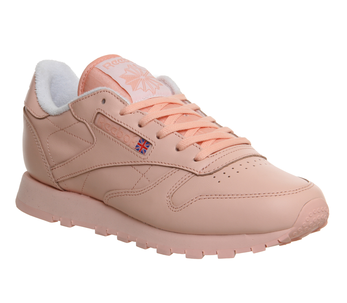 coral reebok trainers Cinosural International School