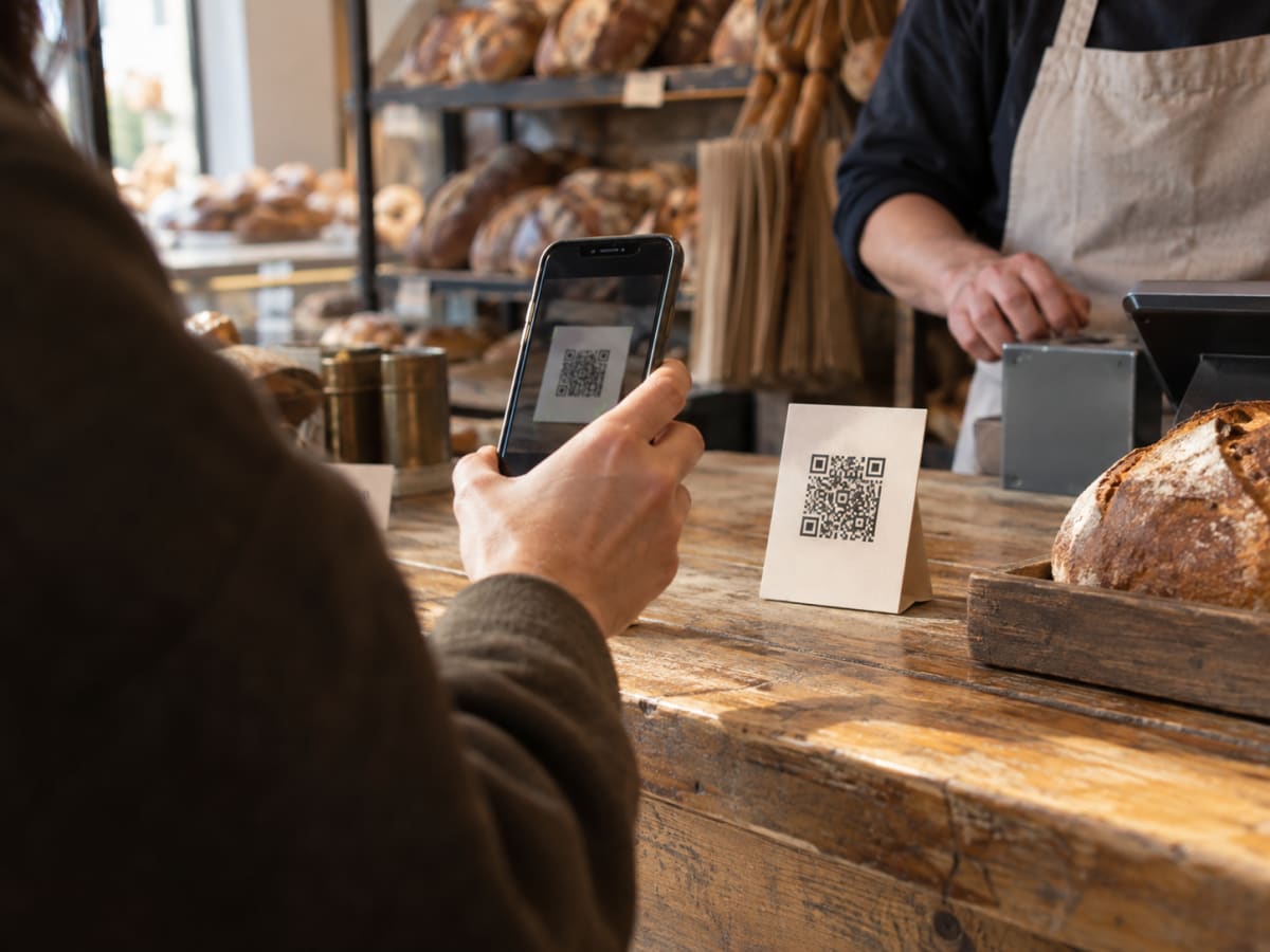A customer scanning the code at a counter