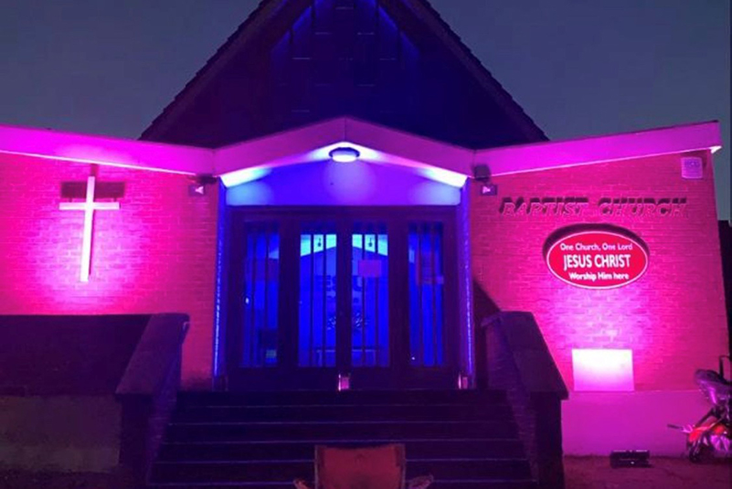 Louise's church lit up pink and blue