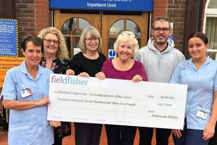 Patricia Aston presents a cheque to staff at Weldmar Hospice