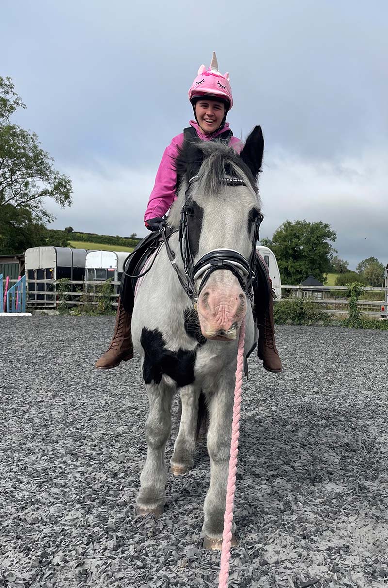 Lottie Sharpe riding her horse